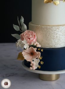 Navy and Blooms Wedding Cake