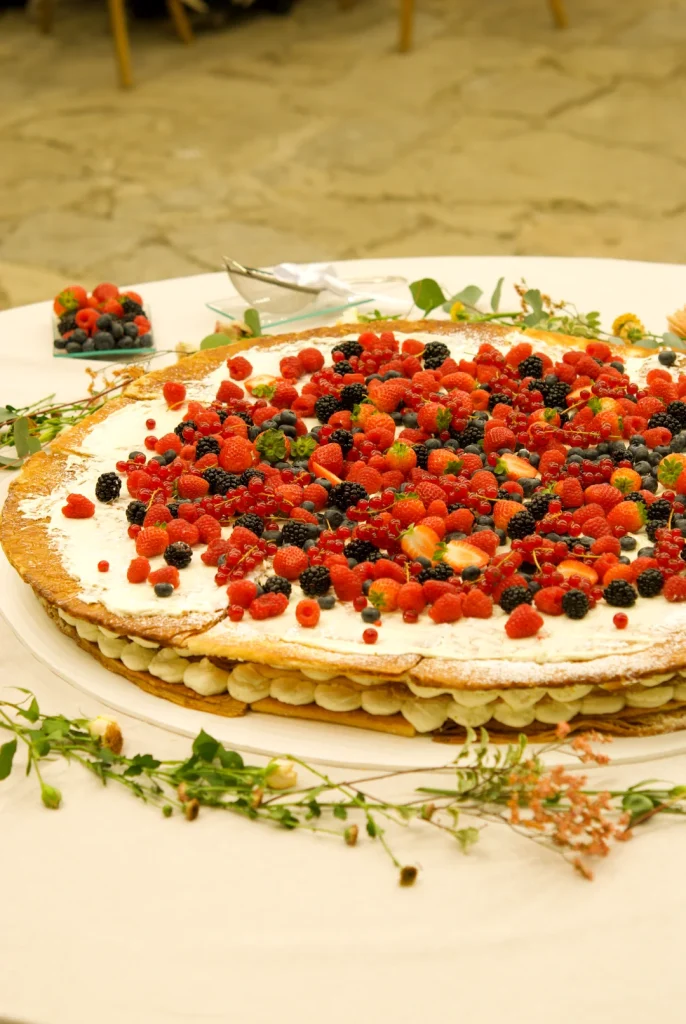 Side view of a millefoglie wedding cake showing the puff pastry and cream layers