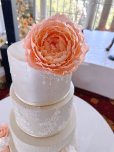 peach blooms wedding cake