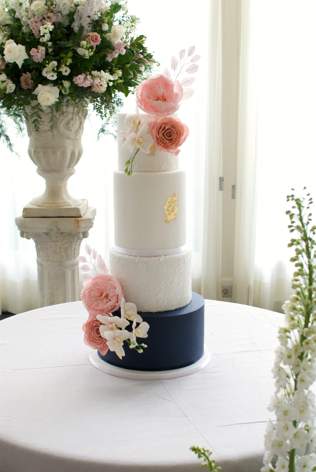 Navy and blooms Wedding Cake