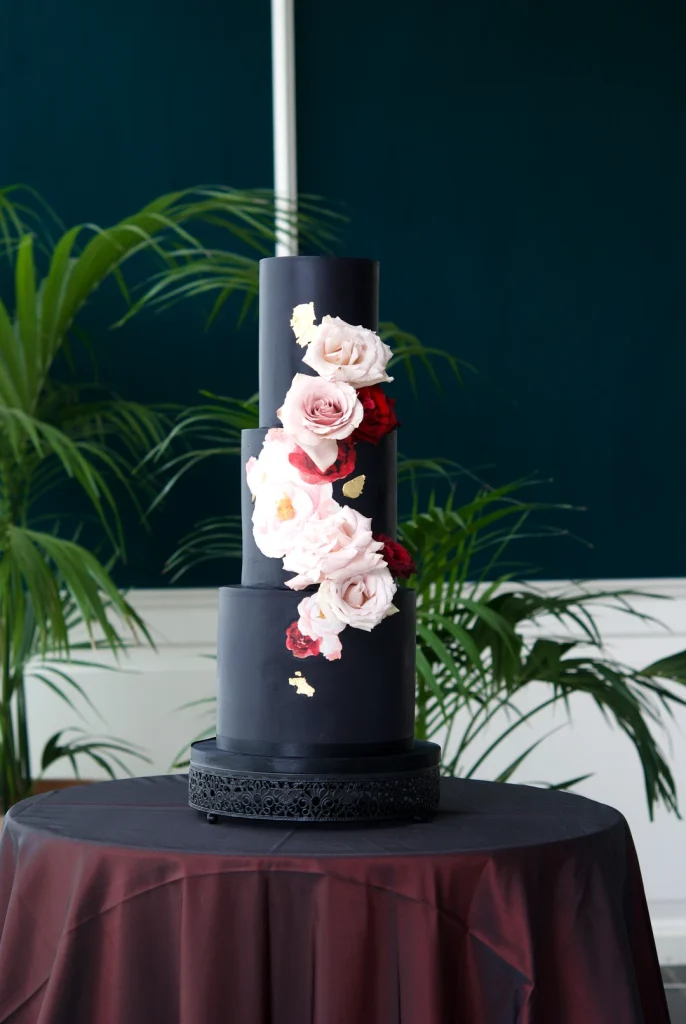 Black wedding cake with roses, a bold alternative to a white wedding cake