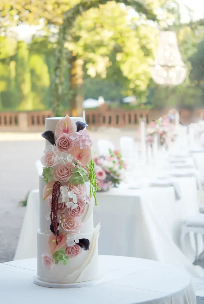 Sugar flower wedding cake with a cascade of blush roses at Castell de Sant Marçal, Barcelona
