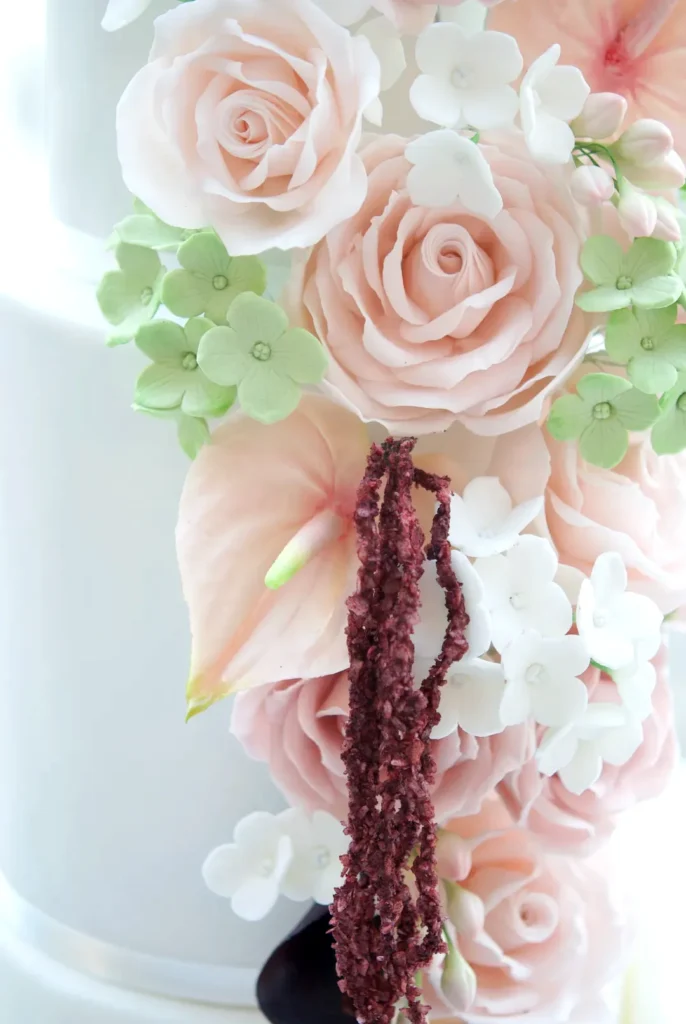 Handmade nude sugar roses, hydrangeas and anthurium on a white wedding cake by Mericakes Barcelona
