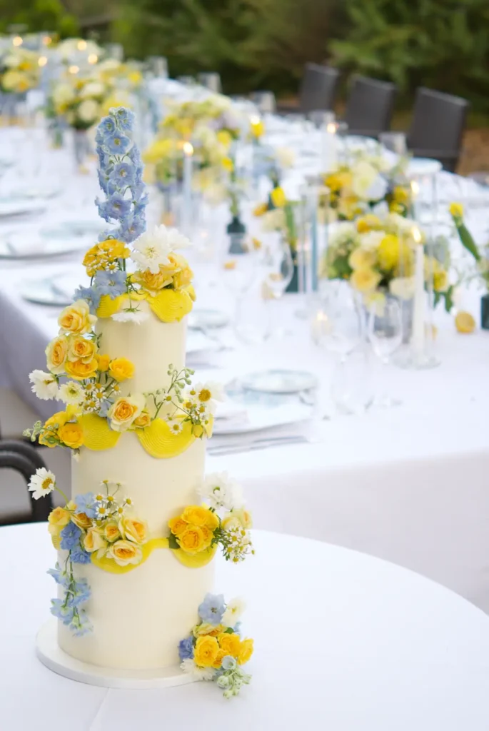 Wedding cake displayed by the long guest table at Hotel Santa Marta, Lloret de Mar