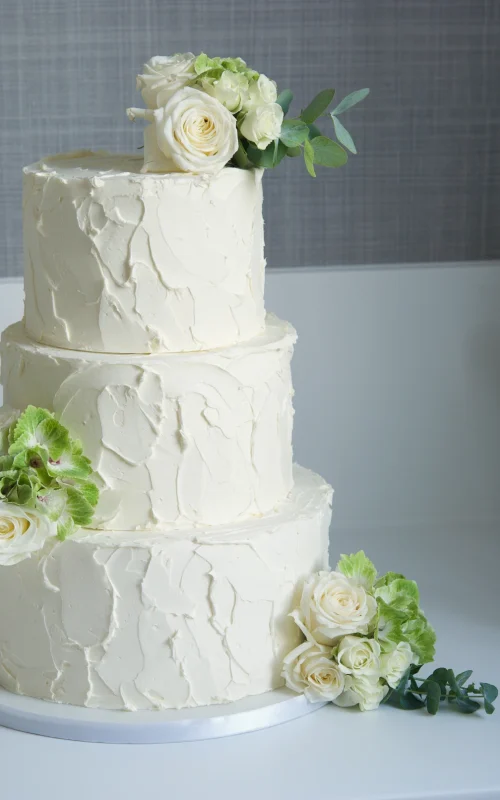 Rustic cream and flowers wedding cake